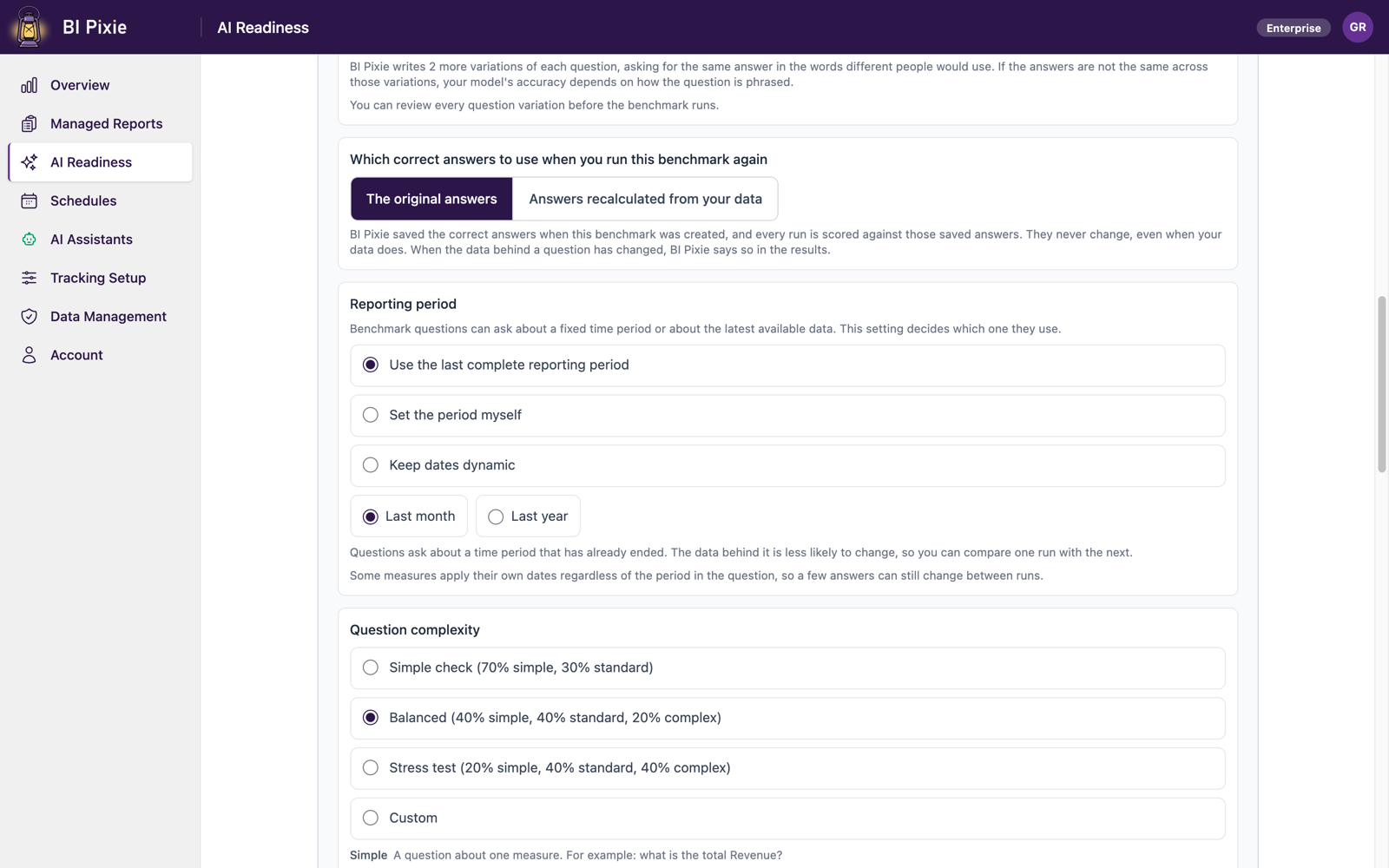 The middle of the benchmark strategy panel: a note that BI Pixie writes two more variations of each question, a choice between the original answers and answers recalculated from your data when the benchmark runs again, the Reporting period setting with Use the last complete reporting period selected and a Last month period size, and the Question complexity setting with Balanced selected